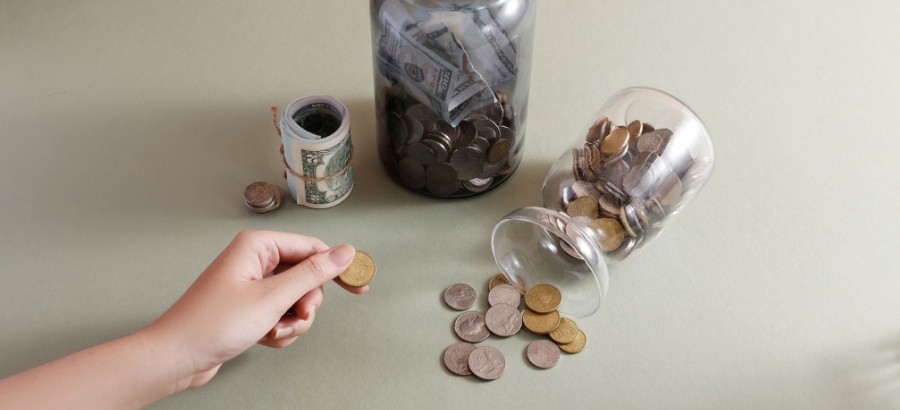 Coins on a table being divided